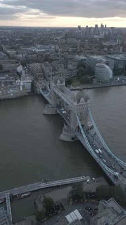 Aerial video of the city of London and the lighthouse bridge in London at night