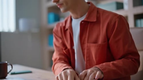 Manager Hands Writing Notes in Notebook Working at Laptop in Office Closeup