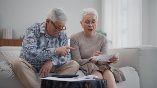 Senior Couple Working on Finances at Home
