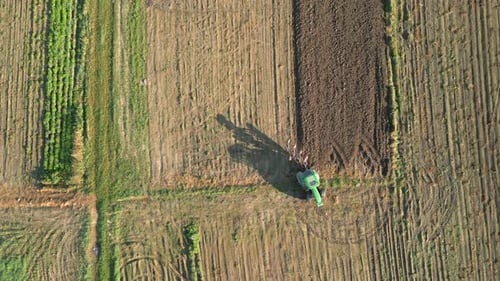 Tractor Plows Land In The Field Aerial