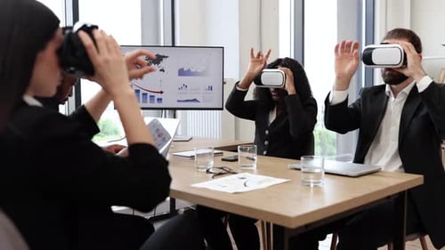 Business Professionals Using Virtual Reality in Modern Office