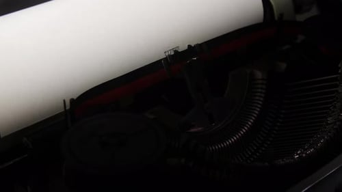 Typing on Vintage Typewriter with Clean White Paper
