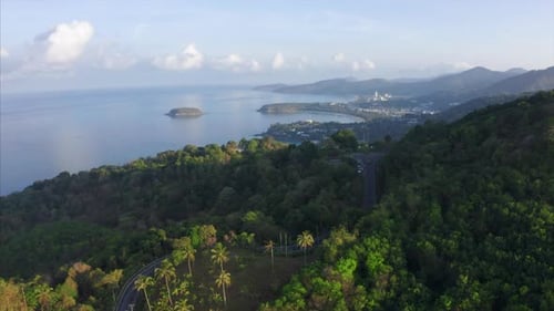 Aerial view of the tropical coastline with beaches and green lush forest. Phuket island, Thailand