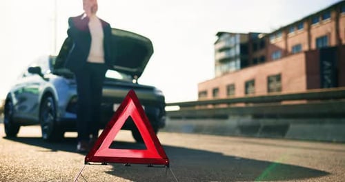 Warning triangle, car breakdown and man with phone call in road for engine fail, help or emergency