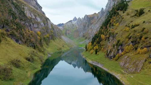Exploring the Serene Beauty of Falensee Lake in Switzerland Amidst Majestic Mountains