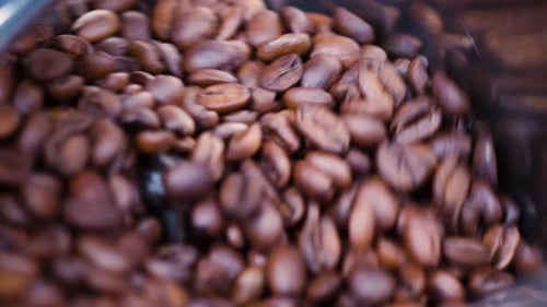 Coffee Beans Spinning in Roasting Machine Close Up