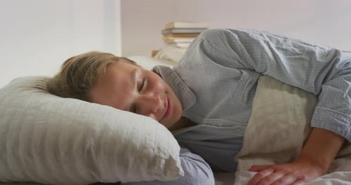 Woman Sleeping Soundly in Bed at Home