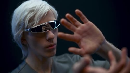 Man with futuristic glasses using virtual interface