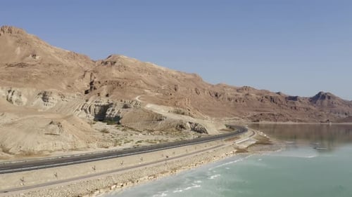 Dead Sea hotels and waterfront highway on a beautiful morning, Aerial view