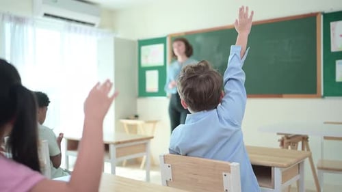 Teacher and students, Learn and study in a classroom of school where youngsters sit and listen