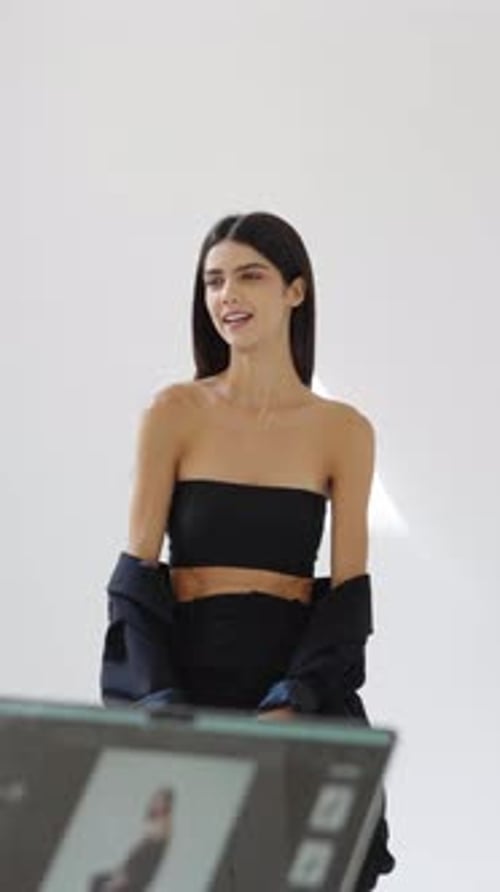 Glamorous Woman Posing in a Bright White Studio