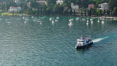 Passenger Ferry Leaving Garda Harbor on Lake Garda Aerial