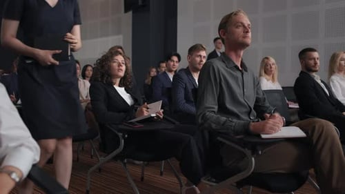 Group of People Listens Speech at Business Conference. Stage Talk at Summit