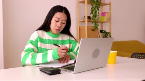 Young Adult Working from Home at Desk