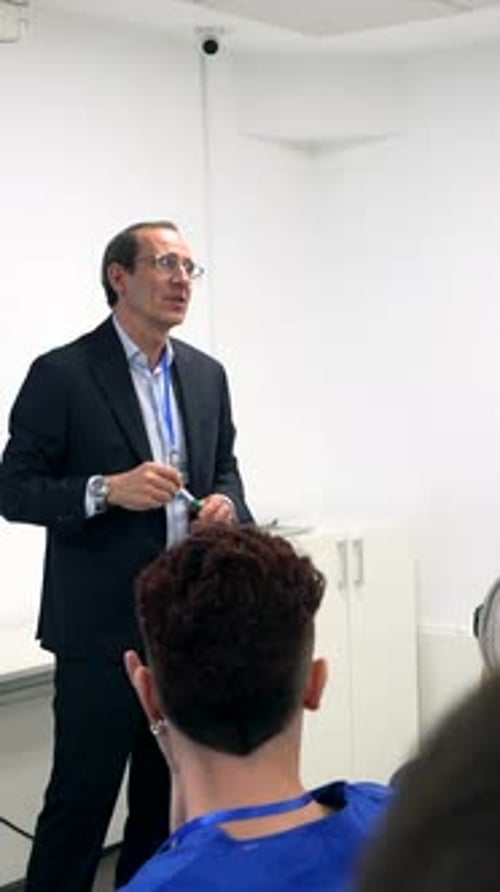 Doctor giving medical lecture to hospital interns