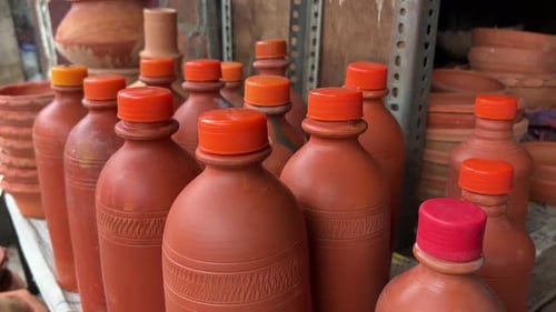 Handicraft shop selling clay water bottle with plastic cap at a local shop in Kolkata, India.