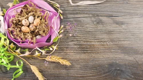 Decorative Easter Nest with Speckled Eggs on Wood