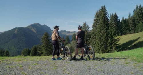 Bikers Sharing Stories Next To Their Cycles