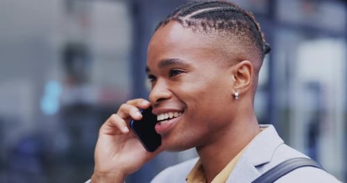 Young Adult Talking on Cell Phone in Urban Setting