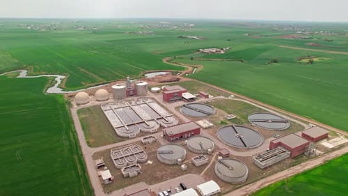 Aerial Drone View of Modern Water Treatment Plant in Green Valley, Clean Environment Concept