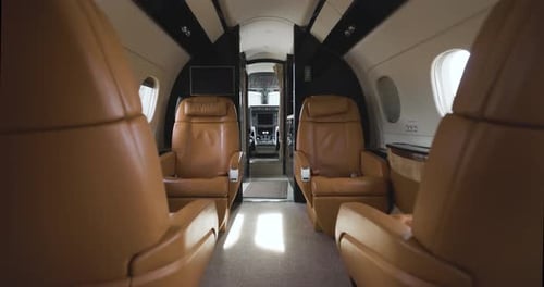 Private Jet Interior With Tan Leather Seats