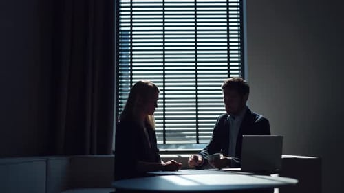 Business Deal: Man and Woman Negotiate Finances
