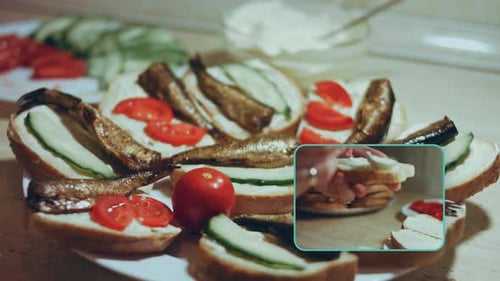 Hands Preparing Sandwiches with Fish and Vegetables