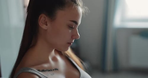 Woman Crocheting with Hook at Home Indoors