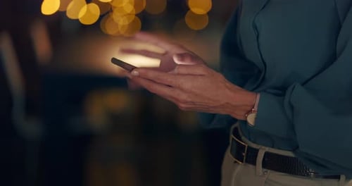 Business woman, hands and typing on a phone while doing research on the internet in office at night