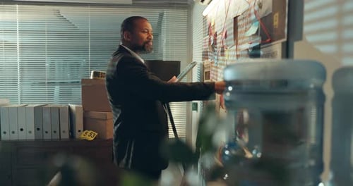 Man, crime board or night with tablet for investigation or tracking murder suspect in office
