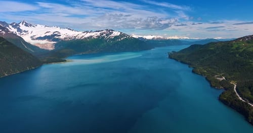 Amazing blue waterscape of the river flowing among the stunning mountains.