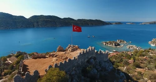 Scenic Coastline with Castle and Flag