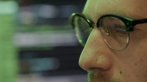 Adult Wearing Glasses Looking at Computer Screen