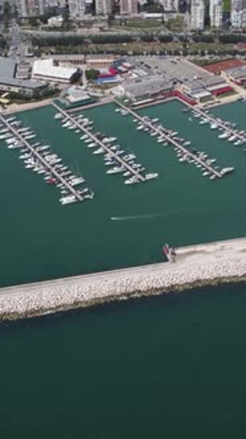 Drone Image Moving Towards the City Over the Marina
