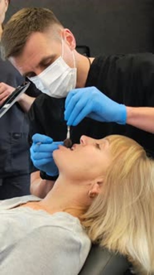 Dentist Working on a Patient's Teeth