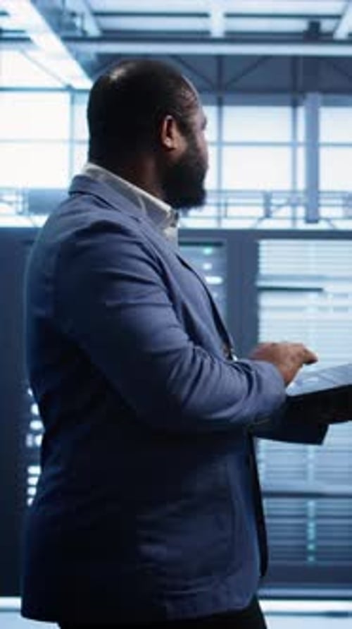 Vertical Video Data Center Worker Fixing Errors Affecting Supercomputers
