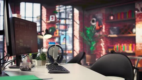 Office Desktop Setup Includes Monitors Displaying Terminal Interfaces