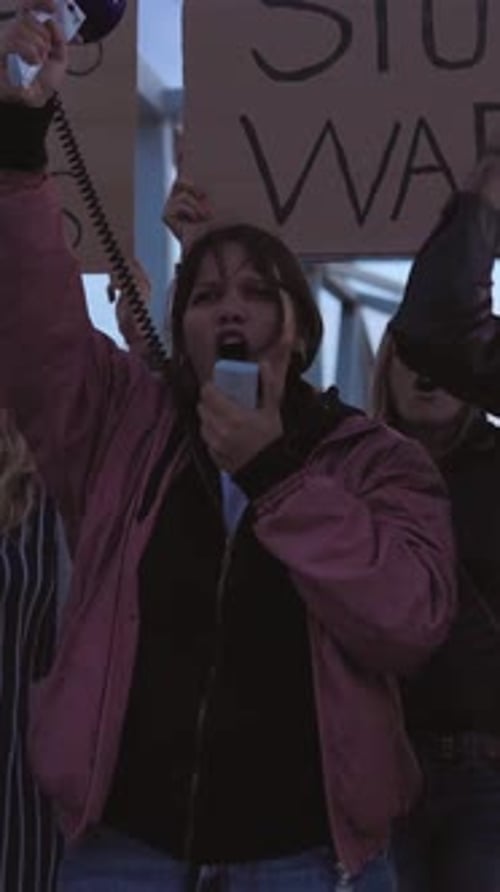 Woman with Megaphone Protests in Urban Location