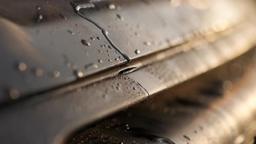 Water Drops are Dripping From the Car Panel Wet Car Concept