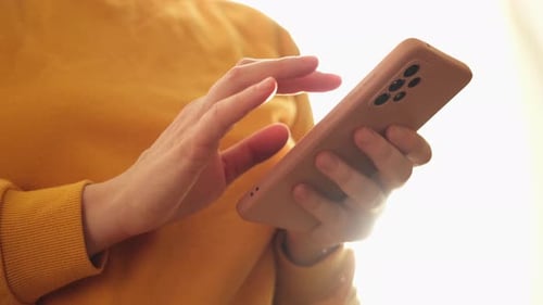 Hands Using Smartphone Technology Indoors