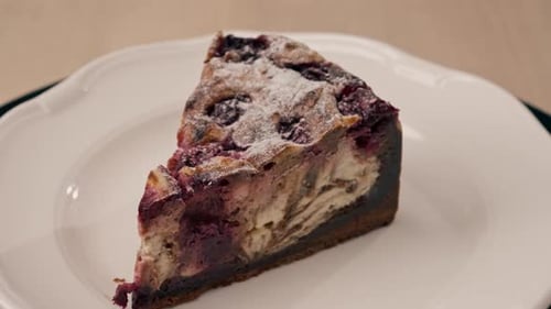 A dessert close-up of a piece of delicious cake lying on a white plate in an Italian restaurant