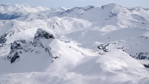 Beautiful Snow Covered Sunny Winter Mountain Landscape AERIAL