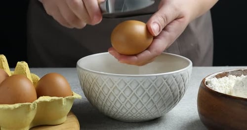 Cracking an Egg into a Mixing Bowl