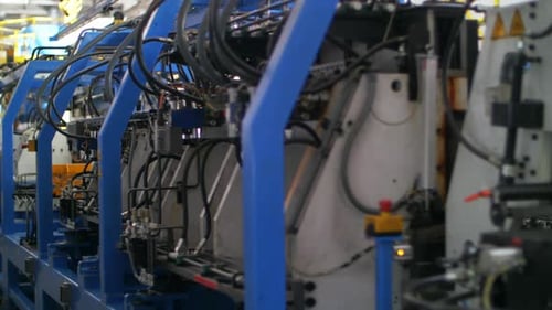 Factory Machinery Working on Industrial Plant. Industrial Machine Processing Metal at Manufacturing