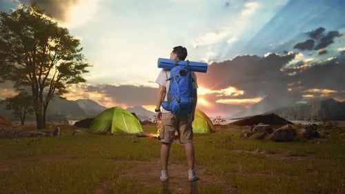 Male Looking Around While Tent Camp Lakeside