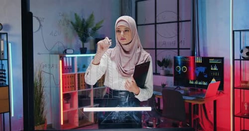 Woman Drawing Graphs on Whiteboard in Modern Office
