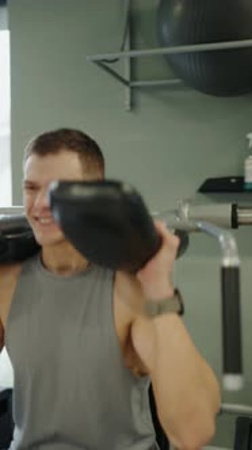 Man Using Leg Press at the Gym