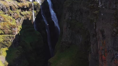 Aerial View of Majestic Glymur Waterfall In West Iceland on a Bright Sunny Day
