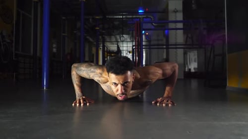 Strong Black Man Doing Push Ups at Modern Gym Afro American Sportsman Exercising at Sport Club