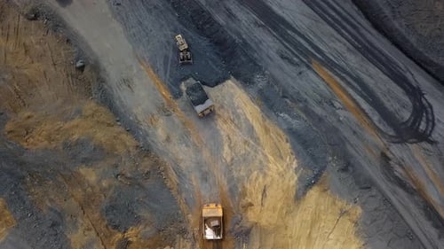 A Stunning Aerial View Depicting Heavy Machinery Engaged in Large Scale Mining Operations Stock Clip